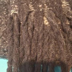 Scialle grote bruine sjaal, come riportato da De Tovertuin utilizzando iLost