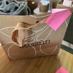 Tote bag, Trousers & Body lotion, as reported by Conscious Hotel Westerpark using iLost