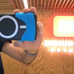 Powerbank black with white circle, as reported by MEININGER Hotel Innsbruck Zentrum using iLost