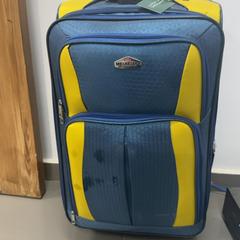 Wheeled suitcase ازرق واصفر, as reported by محطة بريدة (بريدة) using iLost