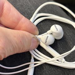 Witte Philips oordopjes, come riportato a iLost