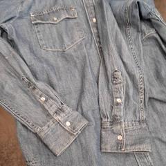 Blusa Jeans, ha sido reportado por Rotterdam The Hague Airport con iLost