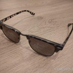 Bruin/zwarte zonnebril, half randloos+pantermotief, gerapporteerd met iLost