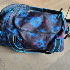 Blauwe Dakine sporttas, ha sido reportado a iLost