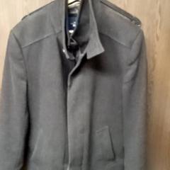 Coat Grey, zoals gemeld door Mövenpick Hotel Amsterdam City Centre met iLost