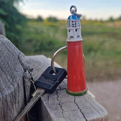 Sleutel met vuurtoren hanger, gerapporteerd met iLost
