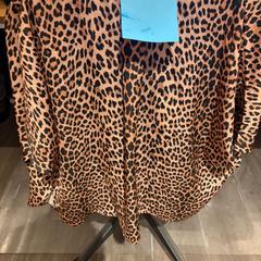 Camisa, segundo informou Amsterdam ID Aparthotel usando iLost