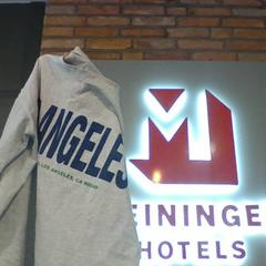 T-shirt Angel, zoals gemeld door MEININGER Hotel Hamburg City Center met iLost