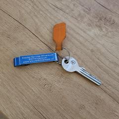 Huissleutel met oranje tag, som rapporterats till iLost