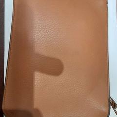 Pochette marron, a été signalé par TCL utilisant iLost