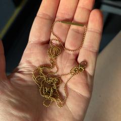 Goudkleurige ketting, como reportado ao iLost