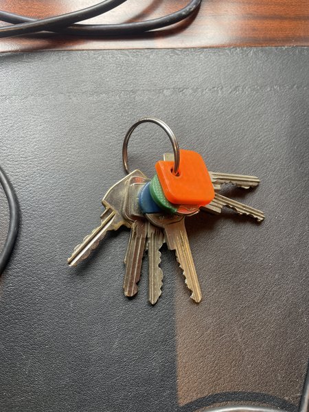 Sleutels Sleutelbos met label oranje, groen en blauw