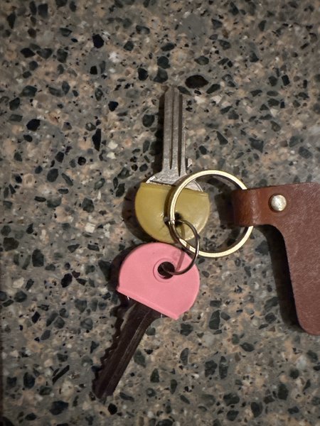 Sleutels Geel en roze sleutelkapje